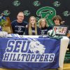 Reagan Volleyball’s Brenna Heffron signs with St. Edward’s University